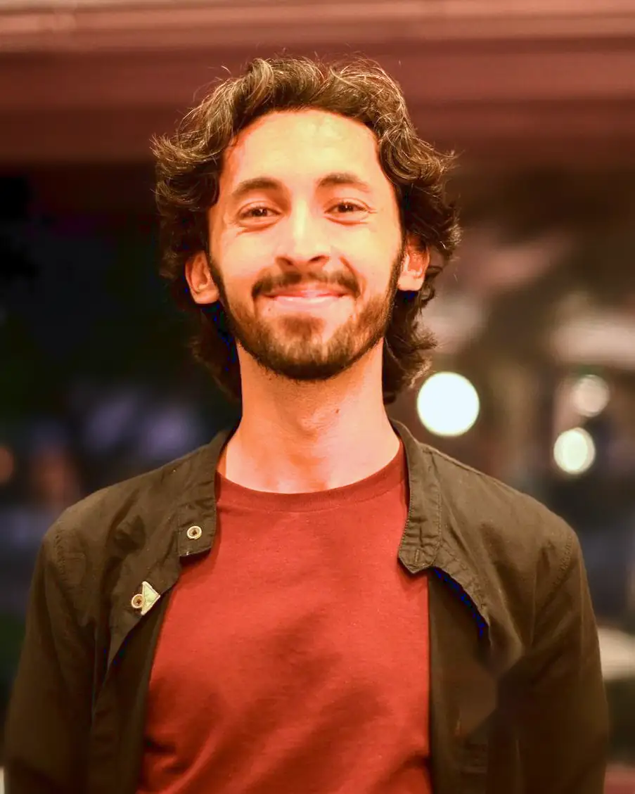 Mohammed Bukhari, smiling, at a team event.